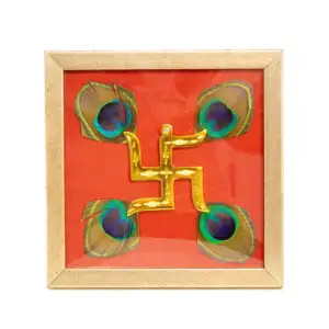 Brass Swastik with Peacock Feathers & Red Silk in Brown frame