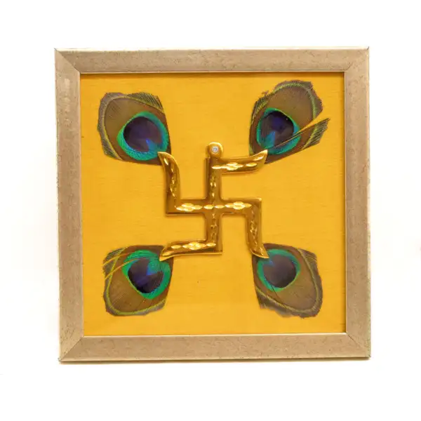 Brass Swastik with Peacock Feathers & Yellow Silk in Brown frame